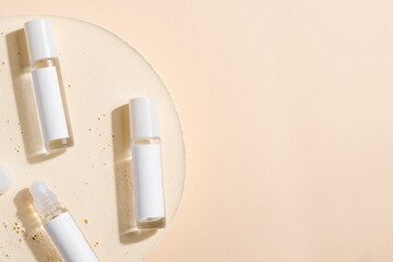 glass product package perfume samples on beige background