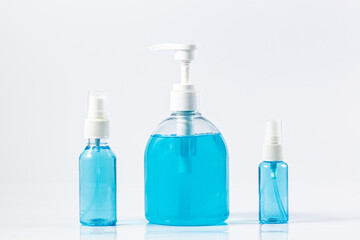 Plastic dispenser sanitizer alcohol gel pump and spray bottle for washing hand hygiene prevention of coronavirus virus studio shot on white background