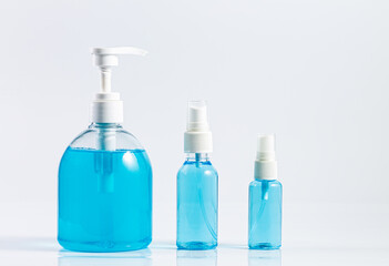 Plastic dispenser sanitizer alcohol gel pump and spray bottle for washing hand hygiene prevention of coronavirus virus studio shot on white background