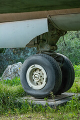 Front landing gear of army combat jet closeup detailed view