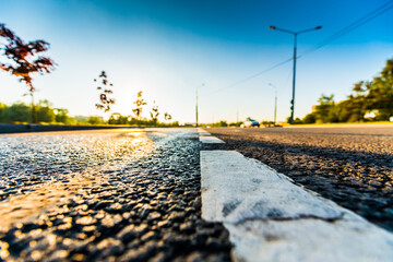 Sunset after rain, the empty highway. Wide angle view of the level of the dividing line