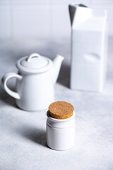 White kitchenware on grey background