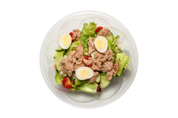 Fresh tuna salad with lettuce, cucombers, cherries and eggs.