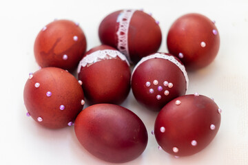 Several brown chicken eggs with white beads