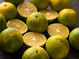 Fresh Mousambi OR Green lemon stock image on dark background.