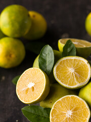 Obraz na płótnie Canvas Fresh Mousambi OR Green lemon stock image on dark background.