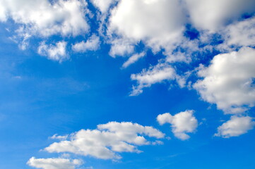 blue sky with white fluffy clouds