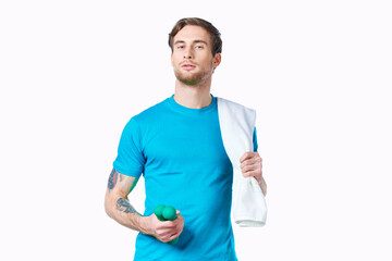 man with dumbbells in hands towel on shoulder workout fitness light background