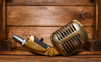 vintage microphone on wooden background