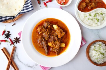 Shahi Mutton curry, Mutton masala, Mutton korma is a famous Spicy non-vegetarian dish of India. It's made out of Goat meat along with spices. Served with rice and roti. copy space.