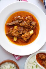 Shahi Mutton curry, Mutton masala, Mutton korma is a famous Spicy non-vegetarian dish of India. It's made out of Goat meat along with spices. Served with rice and roti. copy space.