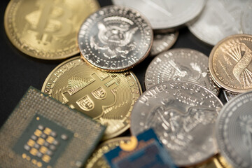 Microchip next to gold Bitcoin coins and one dollar coins. Computing power to mine crypto currencies. Digital assets. Microprocessor with BTC and USD