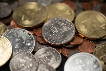 One dollar coin on top of pennies and golden Bitcoin coins. Crypto currency and dollar coins. Digital blockchain technology
