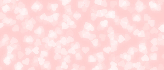 White heart shape bokeh on pink background