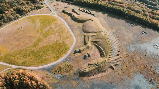 4k aerial view shape of a pit pony on top of a closed, reclaimed coal mine Penallta, Wales