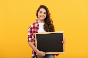 happy teen girl hold school blackboard for copy space, promotion