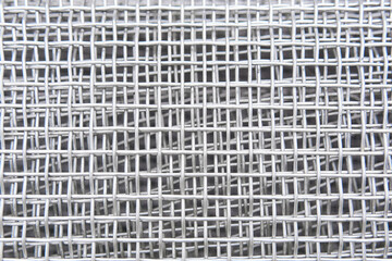 abstract background - roll of galvanized metal mesh close up