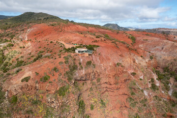 La Gomera, Canary Islands - Aerial view of erosion landscape with red soil on the north coast above Agulo with a view to Tenerife.
