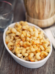 mac and cheese, macaroni pasta in cheesy sauce - American style