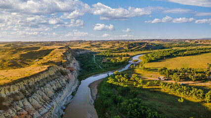 early morning view from Sully Creek State Park - Whitetail Flats Campground - Little Missouri River  - near Medora and Theodore Roosevelt National Park - badlands  - obrazy, fototapety, plakaty