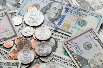 US Dollar Bills and Coins. Dollar Banknotes as Background, distributed USD. banknotes from one to...