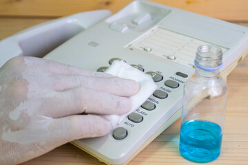 Concept Prevention cleaning frequently, Focus on the high traffic areas that enable pathogens to spread around the telephone equipment such Phone button