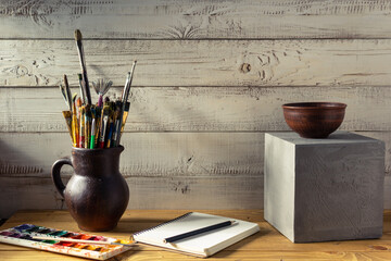Paint brush and artist tools on table background texture. Paintbrush and art still life