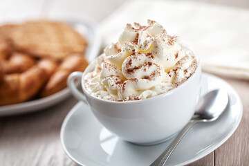 Hot chocolate with whipped cream and biscuits. High quality photo.