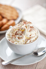 Hot chocolate with whipped cream and biscuits. High quality photo.