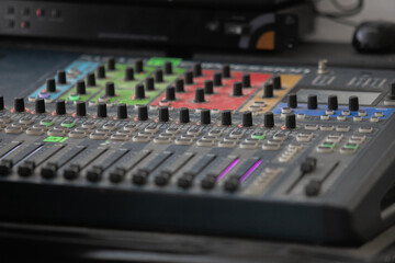 Closeup Analog sound mixer with selected focus. Professional audio mixing console broadcasting.