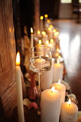 Many candles lit in front of an old fireplace at a local wedding venue in Ontario, Canada.