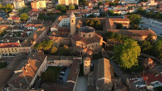 ravenna city centre aerial view at sunrise dawn drone flying backwards over basilica of san vitale