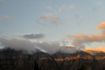 Sunset and fluffy clouds over Stellenbosch Mountain in the Western Cape