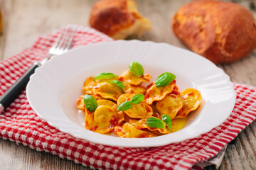 Ravioli with tomato sauce. Typical italian dish.