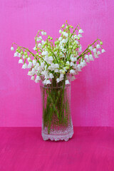 Bouquet of fragrant stems of white Lily of the valley flower bells