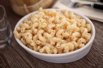 mac and cheese, macaroni pasta in cheesy sauce - American style