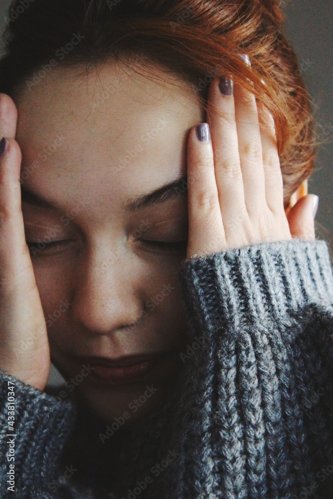 Wall mural closeup portrait of anxious young woman with emotions of anxiety, worry, fatigue