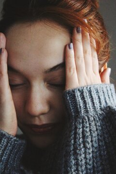 closeup portrait of anxious young woman with emotions of anxiety, worry, fatigue 