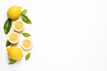 Flat lay composition with fresh juicy lemons and green leaves on white background. Space for text