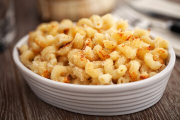 mac and cheese, macaroni pasta in cheesy sauce - American style