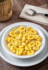 Italian Tortellini In broth on a plate.