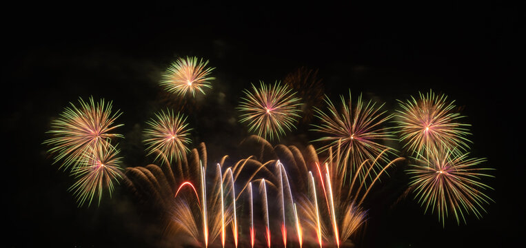 International fireworks festival display at night. Variety of colorful fireworks in holidays celebration isolated on black. Happy New Year Background.