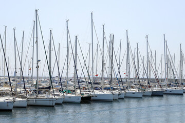 Fototapeta na wymiar Yacht club and marina long view. Boats and yachts in the marina.