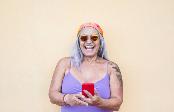 Crazy Old Hippie Woman With Smartphone - Cool Senior Person With Tattoo