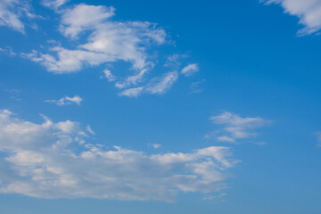 Blue sky and white clouds, the freshness of the new day. The bright blue background gives a feeling of relaxation as in the sky, the scenery of the blue sky and the light of the sun.