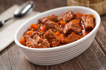 Hot beef stew on a plate. High quality photo.