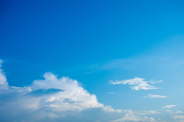 Blue sky and white clouds, the freshness of the new day. The bright blue background gives a feeling of relaxation as in the sky, the scenery of the blue sky and the light of the sun.