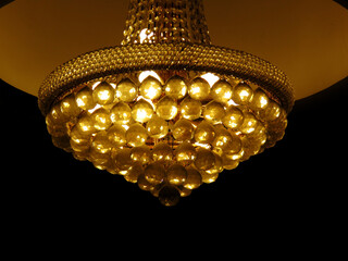 chandelier light in the night, chandelier on the ceiling. chandelier in a dark room for luxury...