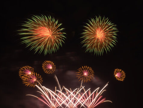 International fireworks festival display at night. Variety of colorful fireworks in holidays celebration isolated on black. Happy New Year Background.