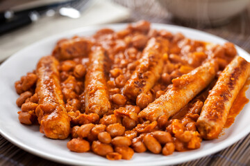 Sausage and Beans with Tomato Sauce on a plate.